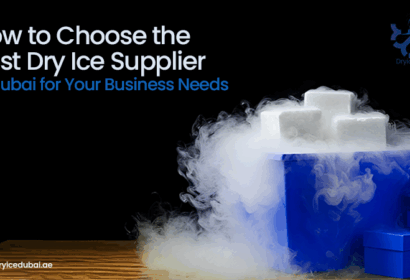 Dry ice blocks emitting fog in a blue container on a wooden surface.